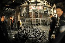 People prepare materials for rescuing miners at the Lisheng Coal Mine in Tanjiashan Town of Xiangtan County, central-south China's Hunan Province, Jan. 5, 2010. Twenty-seven miners were trapped after a fire happened inside the coal mine on Jan. 5. (Xinhua