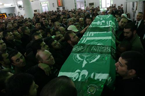 Palestinian mourners attend the funeral of Mahmoud al-Mabhouh, one of the founders of the Islamic movement's armed wing known as Izzedein al-Qassam Brigades, in Damascus, Syria, Jan. 29, 2010. Hamas vowed on Friday to retaliate the assassination of its top military commander Mahmoud al-Mabhouh in Dubai after it blamed Israel for his death. [Bassem Mohamad/Xinhua] 