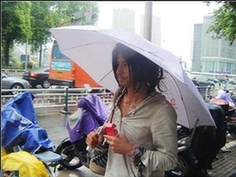 An undated photograph of a homeless man, nicknamed Brother Sharp for his good looks and sharp dress sense, wandering the streets of Ningbo, Zhejiang province, was recently posted on the Internet. He is one of the most talked about personalities in Chinese cyberspace today. [www.tianya.cn]