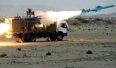 An Iranian Noor missile is launched during war games on April 25, 2010 in southern Iran, near the Strait of Hormuz, the narrow strategically located waterway through which 40 percent of world&apos;s seaborne oil supplies pass.[Xinhua]