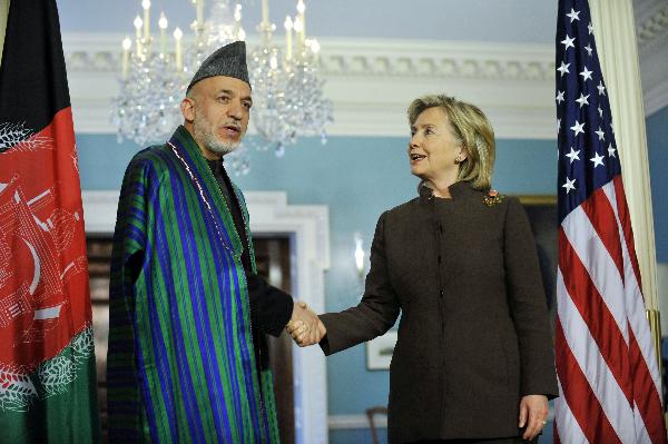 U.S. Secretary of State Hillary Clinton (R) and visiting Afghan President Hamid Karzai meet journalists before their bilateral meeting at the State Department in Washington D.C., capital of the United States, May 11, 2010. [Zhang Jun/Xinhua]