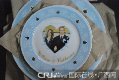 Photo taken on Jan. 10, 2011 shows the plates with the photo of Prince William and Kate Middleton on at a workshop of Tri-Ring Group Corporation in Beiliu City, south China&apos;s Guangxi Zhuang Autonomous Region.