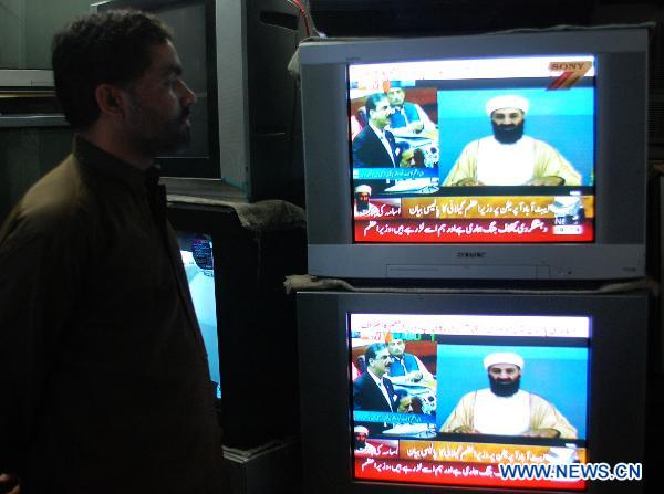 A Pakistani watches the television broadcasting the address of Pakistan's Prime Minister Yusuf Raza Gilani in northwest Pakistan's Peshawar on May 9, 2011. Pakistani Prime Minister Yusuf Raza Gilani on Monday told the parliament that investigation has been ordered into the presence of Osama bin Laden in the city of Abbottabad. [Xinhua]