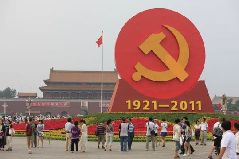 An emblem of the Communist Party of China (CPC) is seen surrounded by flowers on the Tiananmen Square in Beijing, capital of China, June 30, 2011. The emblem and flowers were set up to celebrate the 90th anniversary of the founding of the CPC.