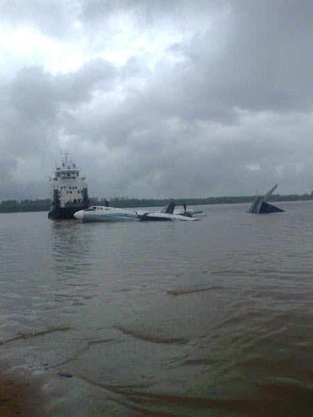 The damaged AN-24 plane, owned by the Angara Airlines, is seen after a hard landing on the surface of the Ob river in Tomsk region in western Siberia July 11, 2011.