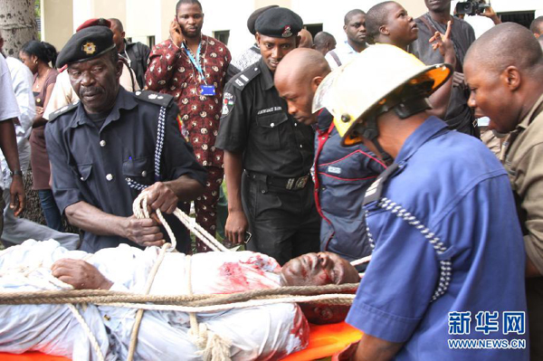 The death toll has gone up to 23 from the UN building explosion. In the picture an injured person is transferred by rescue workers on August 26, 2011. 