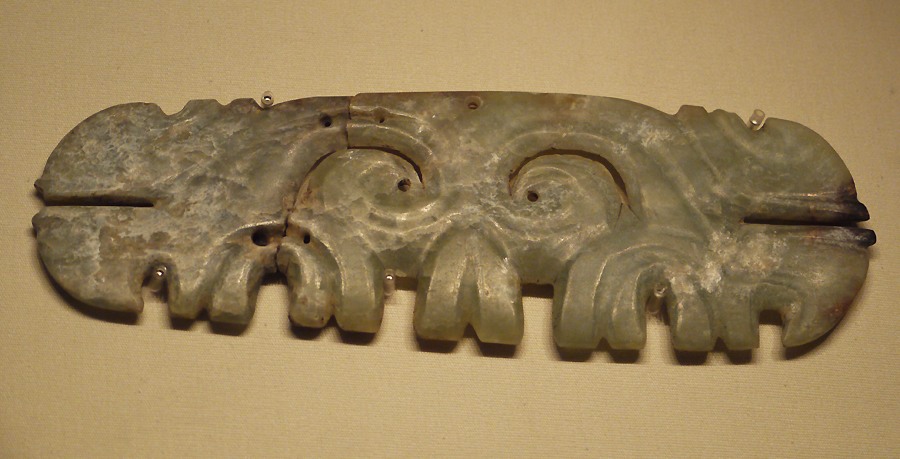 Jade Plaque with Animal Mask Desgin, Hongshan Culture (c. 4700-2900 BC), unearthed at Niuheliang, Lingyuan, Liaoning Province, 2003. It is exhibited in the section of Life and Production in Neolithic China, an exhibition of Ancient China in the National Museum of China.[Photo by Xu Lin / China.org.cn] 