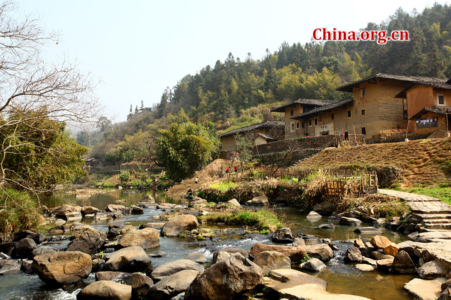 Built on a base of stone, the thick walls of Tulou were packed with dirt and fortified with wood or bamboo internally. The architectural arts of the Fujian Tulou can be traced back nearly 1,000 years, and their design incorporates the tradition of fengshui (favorable siting within the environment).