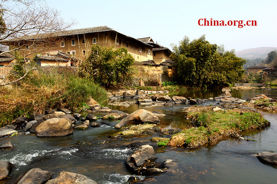 Built on a base of stone, the thick walls of Tulou were packed with dirt and fortified with wood or bamboo internally. The architectural arts of the Fujian Tulou can be traced back nearly 1,000 years, and their design incorporates the tradition of fengshui (favorable siting within the environment).