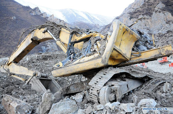 Photo taken on March 30, 2013 shows the accident site after a major landslide hit a mining area of Tibet Huatailong Mining Development Co. Ltd, a subsidiary of the China National Gold Group Corporation, in Maizhokunggar County of Lhasa, capital of southwest China's Tibet Autonomous Region. A total of 83 workers were buried in the landslide, which happened on Friday morning. [Zhang Quan/Xinhua]