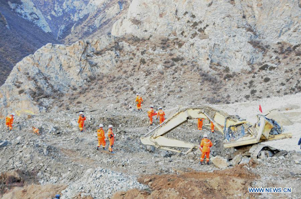 Rescuers work at the accident site after a major landslide hit a mining area of Tibet Huatailong Mining Development Co. Ltd, a subsidiary of the China National Gold Group Corporation, in Maizhokunggar County of Lhasa, capital of southwest China's Tibet Autonomous Region, March 30, 2013. A total of 83 workers were buried in the landslide, which happened on Friday morning. [Zhang Quan/Xinhua]