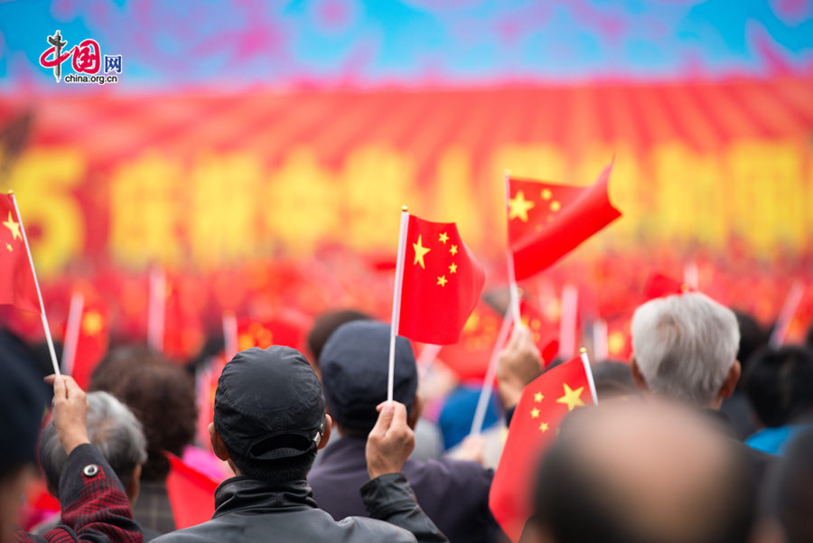 Chaoyang Park in the eastern downtown of Beijing, capital of China, stages grand commemorative activities on Wednesday, Oct. 1, 2014, to mark the 65th National Day holiday of the People&apos;s Republic of China, which was founded on Oct. 1, 1949. The celebrations at Chaoyang Park are in sync with similar activities in all of the around 300 parks in Beijing on this day. [Photo by Chen Boyuan / China.org.cn]