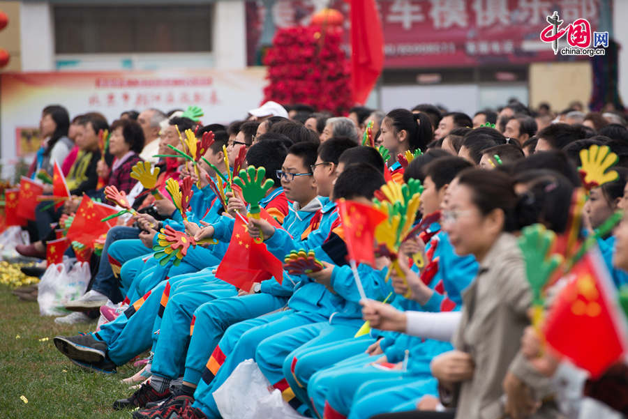 Chaoyang Park in the eastern downtown of Beijing, capital of China, stages grand commemorative activities on Wednesday, Oct. 1, 2014, to mark the 65th National Day holiday of the People&apos;s Republic of China, which was founded on Oct. 1, 1949. The celebrations at Chaoyang Park are in sync with similar activities in all of the around 300 parks in Beijing on this day. [Photo by Chen Boyuan / China.org.cn]