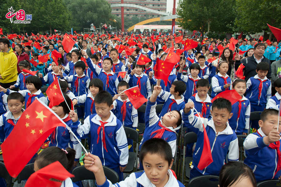 Chaoyang Park in the eastern downtown of Beijing, capital of China, stages grand commemorative activities on Wednesday, Oct. 1, 2014, to mark the 65th National Day holiday of the People&apos;s Republic of China, which was founded on Oct. 1, 1949. The celebrations at Chaoyang Park are in sync with similar activities in all of the around 300 parks in Beijing on this day. [Photo by Chen Boyuan / China.org.cn]